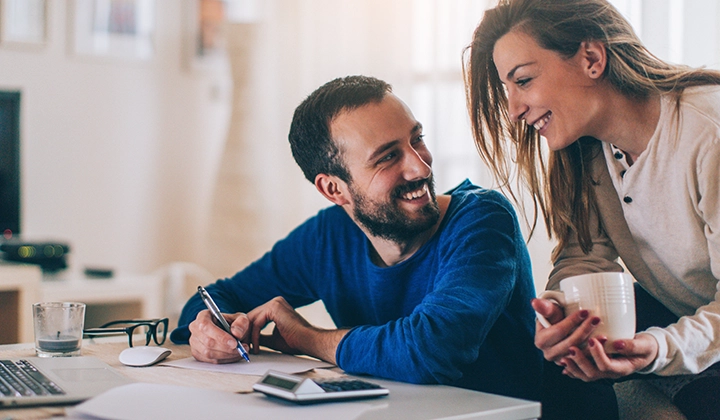 couple looking at checking account