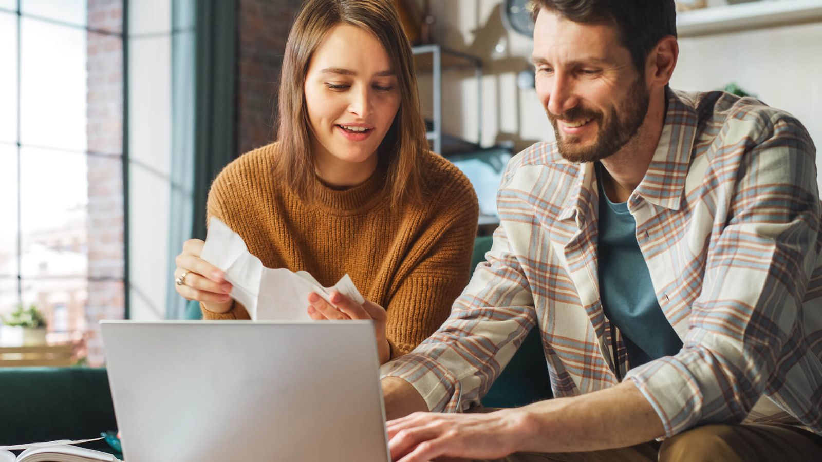 couple looking at checking account